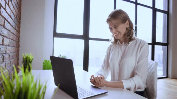 Businesswoman Using Webcam for Call