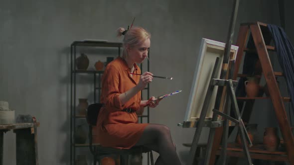 Female Artist Expressing Fertile Imagination in Painting