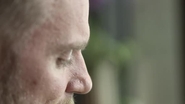 Closeup of a Bearded Blonde Man with a Blurred Out Background