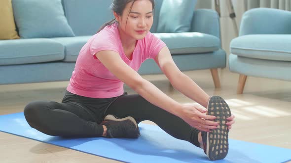 Asian Woman Exercising, Stretching Workout At Home