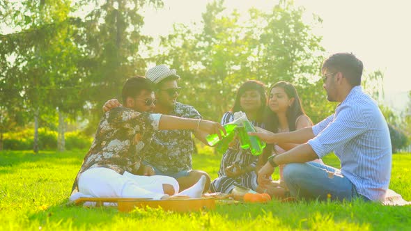 Pakistanian Happy Best Friends Partying with Lemonade and Beer in Summer Park