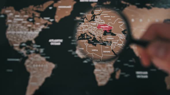 Ukraine on the World Map Under Magnifying Glass