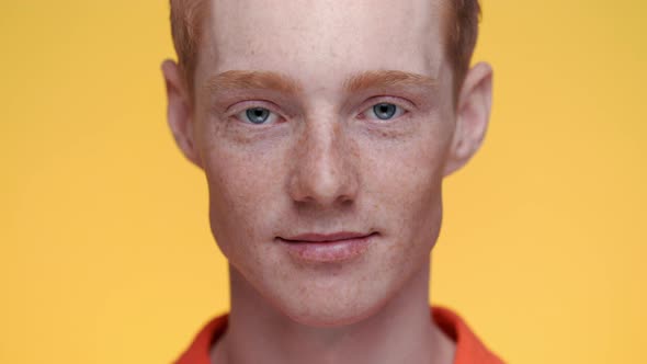 Portrait of Caucasian Man with Red Hair and Freckles on Face