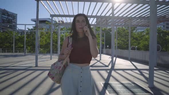 Young woman using smartphone in the city