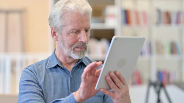 Old Man Using Tablet