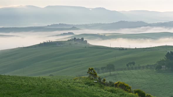 Classical View of Foggy Green Hills of Tuscany, Italy Early in the Morning. Major Travel Destination