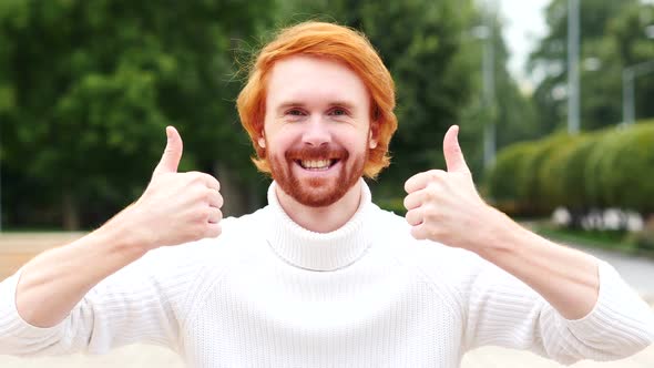 Thumbs Up with Both Hands by Man with Red Hairs, Outdoor