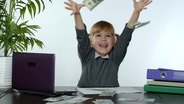 Young Child Girl Boss Holds a Lot of Money, Rejoices in the Win and Makes Money Rain Scatters Money