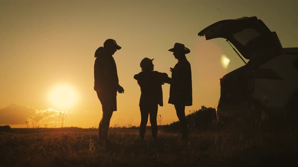 Silhouette the Happy Family of Four People, Mother, Father and Daughter Are Happy Stand on the Open
