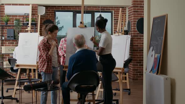 Multiethnic Group of People Drawing Sketch on Canvas