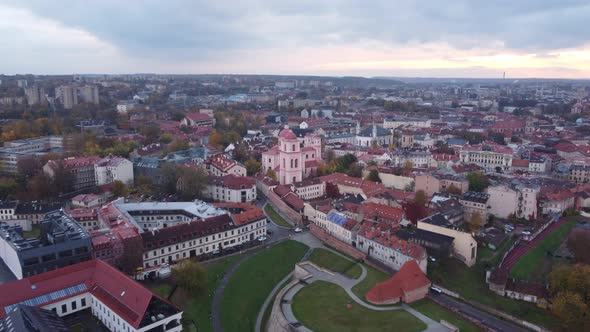 Vilnius cityscape on cloudy day, Lithuania. Aerial flying forward