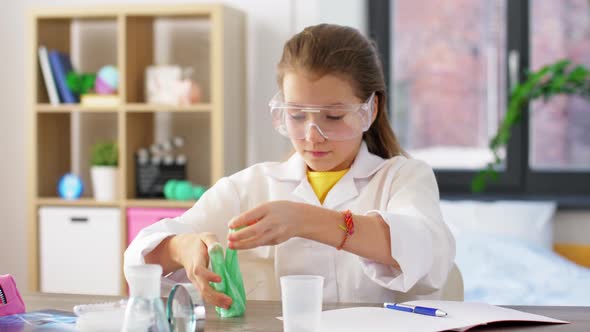 Girl Playing with Slime at Home Laboratory