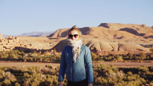 Tourist In Desert Turning To Camera In Ait Benhaddou