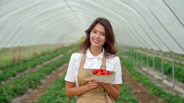 Happy Woman Holding Small Box with Ripe Strawberries