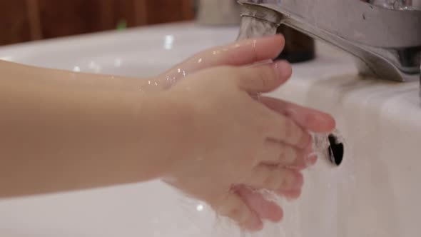 The Boy Washes His Hands