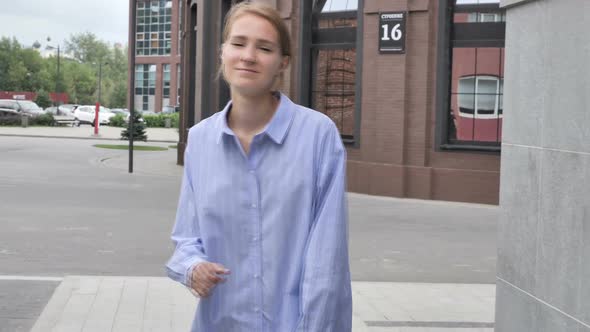 Woman Dancing and Listening Music While Walking on Street