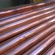 Metal, copper, plumbing pipes stack with shiny reflections at warehouse. - VideoHive Item for Sale