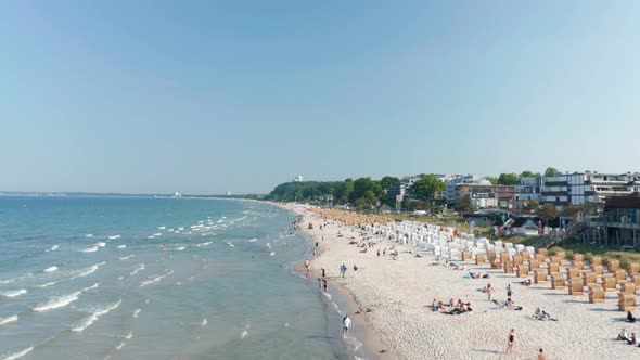 Waves Crashing Against Tourist Beach in Scharbeutz Germany Sunny Day