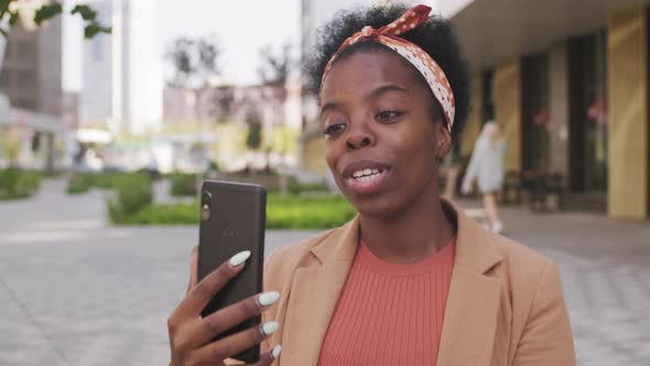  Cheerful African-American Woman Talking on Video Call