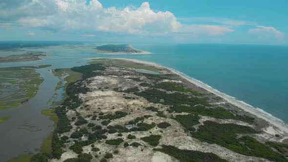 drone shots of the sand dunes and marsh lands at the coast