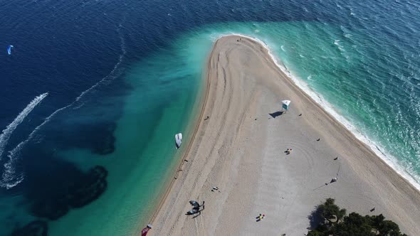 Paraglider that are preparing to surf at the golden horn beach in Croatia.