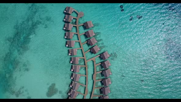 Aerial drone nature of marine shore beach vacation by blue ocean and white sandy background of a day