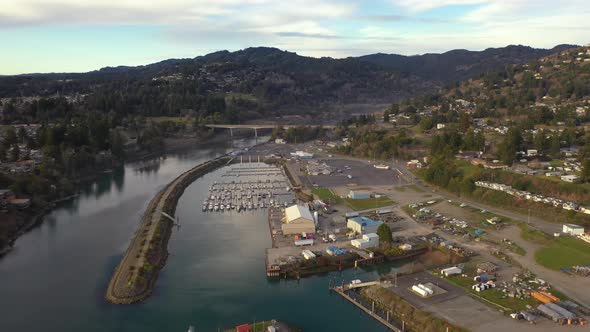 Brookings, Oregon Coast, USA. Boats docked on Chetco River marina and harbor. Aerial view.