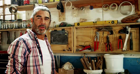 Attractive carpenter smiling for camera