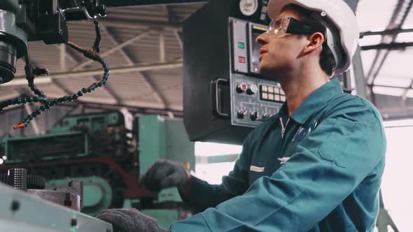 Smart Factory Worker Using Machine in Factory Workshop