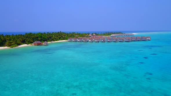 Aerial drone abstract of tropical coastline beach by blue lagoon with sand background