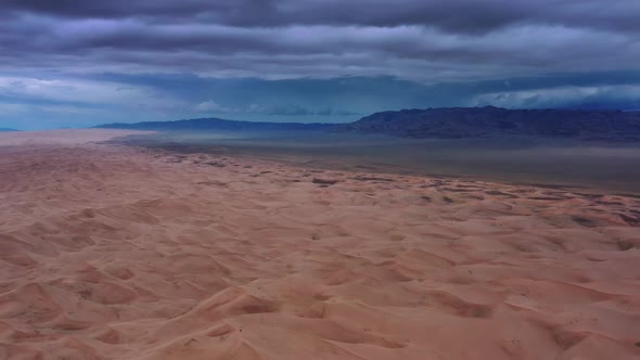 Sand Dunes with Storm Clouds in Gobi Desert