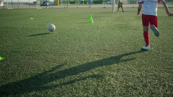 Little Footballer Is Running and Kicking Goal