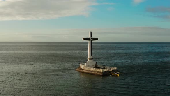 Sunken Cemetery Cross in Camiguin Island, Philippines