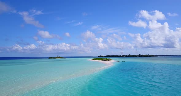 Wide fly over abstract shot of a sandy white paradise beach and blue ocean background in best qualit