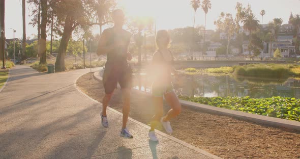 Athlete Couple Jogging In The Park
