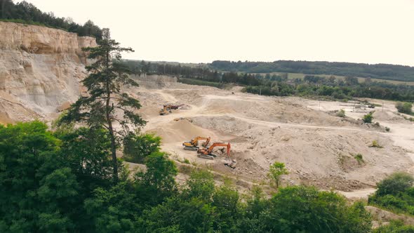 Large Industrial Sand Quarry. Equipment That Works in a Sand Quarry. The Mountain From Which Sand Is