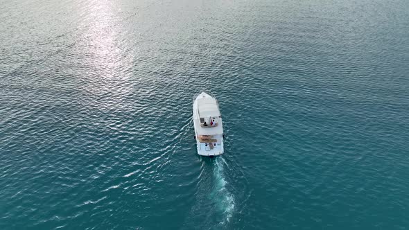 A couple rides a yacht aerial view 4 K Turkey Alanya