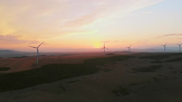 Wind Turbines With Sunset Over Horizon