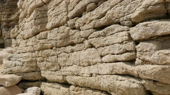 Stone landform cliff levels in northern Europe and France  near ocean beach slow tilt 4K 3840X2160 U