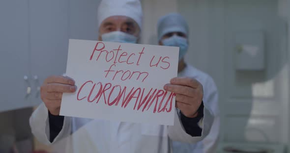 Portrait of Doctor Shows Inscription with Beg Protect Us From Coronavirus