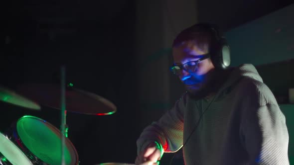 Drummer Playing Drums in the Club