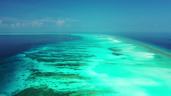 Aerial top down nature of idyllic sea view beach wildlife by blue ocean and white sandy background o