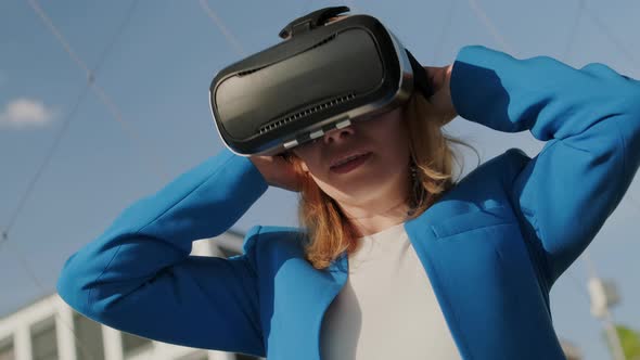 Woman Wearing Virtual Reality Headset and Start to Use Virtual Interface