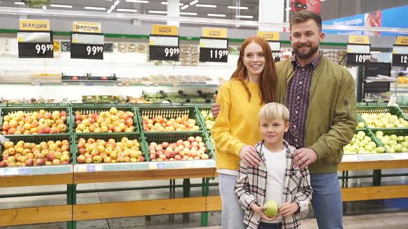 Caucasian Family with Child Boy in Food Store
