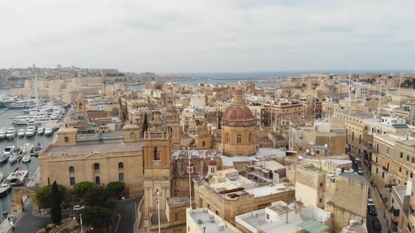 Aerial Counterclockwise Wide Shot of Senglea Basilica In Malta