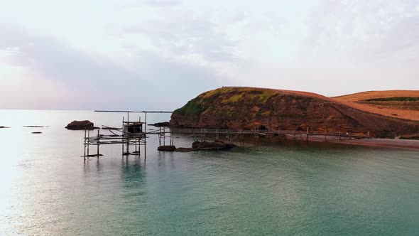 Aerial View of Beautiful and Desolated Sand Beach Green Bushes and Marine Vegetation Wooden Bridge