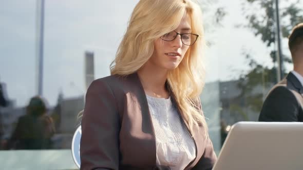 Productive Businesswoman Working on Laptop Computer