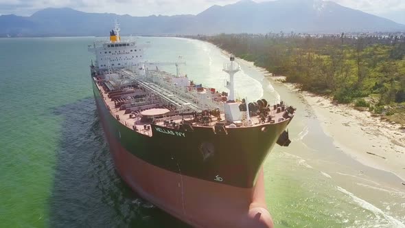 Drone Moves From Tanker Wheel House Along Deck on Shallow Sea