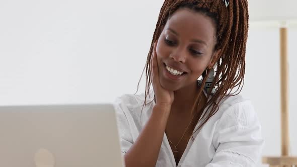 Woman Looking at Laptop Screen with Positive Smile Emotion Spbi