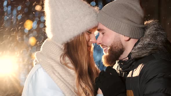 An Attractive Couple in Love a Stylish Couple Wearing Warm Clothes Cuddling Together and Looking